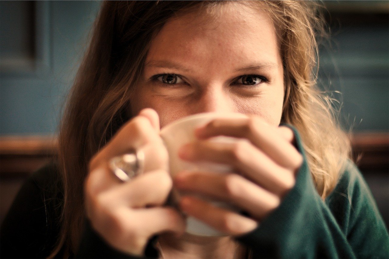 girl, woman, smile, smiling, happy, coffee, tea, cup, drinking, eyes, people, coffee cup, cozy, comfortable, relaxed, sipping, brown coffee, tea cup, brown happy, brown relax, brown tea, brown smile, brown eye, brown happiness, brown cup